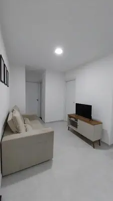 Uma televisão e/ou sistema de entretenimento em Apartamento em Fortaleza