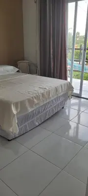 Uma cama ou camas num quarto em Casa da Lelê