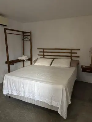 Uma cama ou camas num quarto em Casa Aura Solis Preá