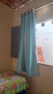 Uma cama ou camas num quarto em Retorno às Raízes Casa de Praia