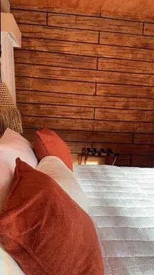 Uma cama ou camas num quarto em Suítes House Refúgio Fortim