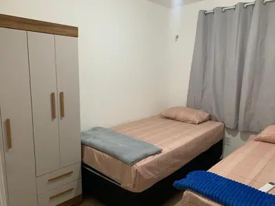 Uma cama ou camas num quarto em 2quartos vista mar Praia do Futuro