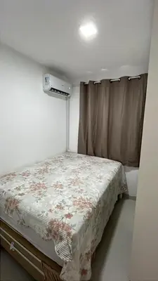 Uma cama ou camas num quarto em Apartamento Fortaleza Beira-mar praia do futuro