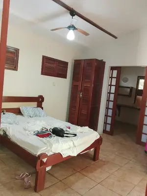 Uma cama ou camas num quarto em Casa do cajueiro