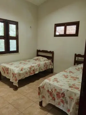 Uma cama ou camas num quarto em Casa do cajueiro