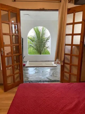Uma cama ou camas num quarto em Casinha branca FORTALEZA