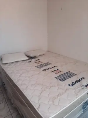 Uma cama ou camas num quarto em Apartamento para 4 pessoas na rua principal de Beberibe