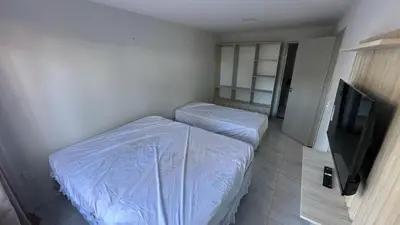 Uma televisão e/ou sistema de entretenimento em Via do Sol flats