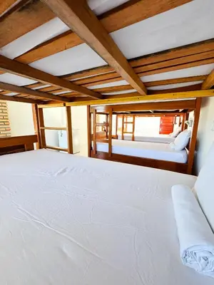Uma cama ou camas num quarto em ALBERGUE Lagoinha