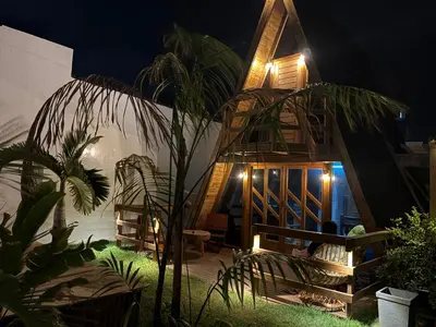 Um jardim no exterior de Chalé Cabana