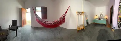 Uma cama ou camas num quarto em Vila Manguita Suíte Manguita