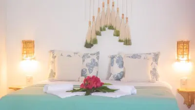 Uma cama ou camas num quarto em Vila Manguita Suíte Manguita