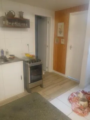 A cozinha ou kitchenette de Quarto Aconchegante