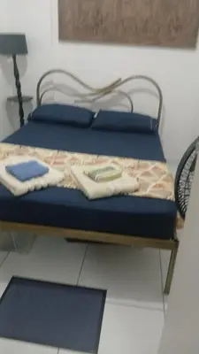 Uma cama ou camas num quarto em Quarto Aconchegante