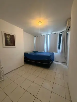 Uma cama ou camas num quarto em Apartamento beira mar sol maior