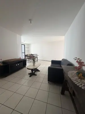 Uma área de estar em Apartamento beira mar sol maior