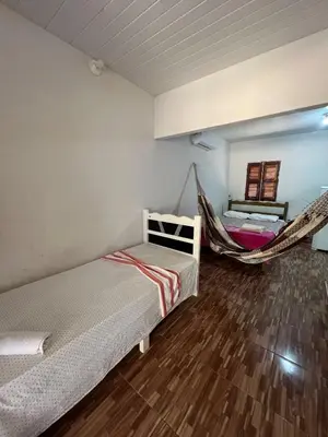 Uma cama ou camas num quarto em Chalé central beach