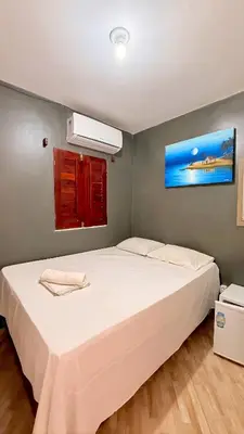 Uma cama ou camas num quarto em Pousada Anauá Jericoacoara