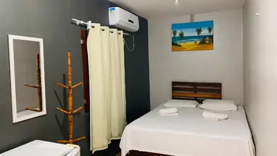 Uma cama ou camas num quarto em Pousada Anauá Jericoacoara
