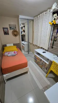 Uma cama ou camas num quarto em Quarto Aconhegante