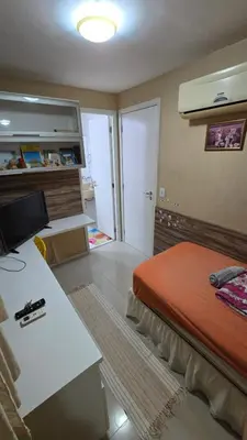 Uma cama ou camas num quarto em Quarto Aconhegante