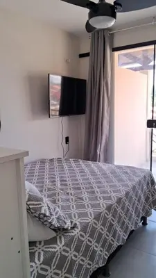 Uma cama ou camas num quarto em Flats Vento da Serra