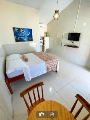Uma cama ou camas num quarto em Sua própria pousada na praia