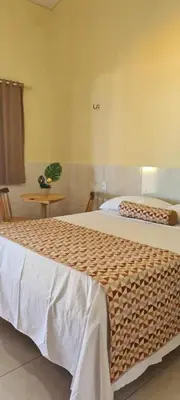 Uma cama ou camas num quarto em Sua própria pousada na praia