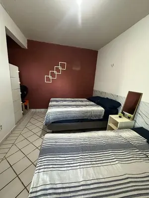 Uma cama ou camas num quarto em Condomínio Porto Canoa