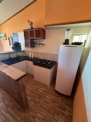 A cozinha ou kitchenette de Sereia beach chalé