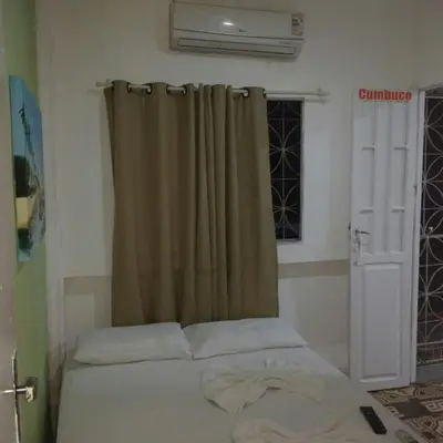Uma cama ou camas num quarto em Pousada Maresia