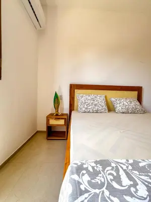 Uma cama ou camas num quarto em Casa da Jô, Fortim Barra