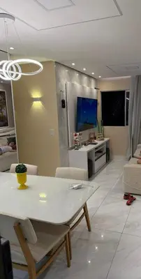 Uma televisão e/ou sistema de entretenimento em Apartamento top CAMBEBA