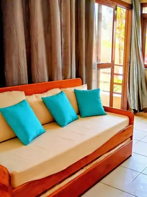 Uma cama ou camas num quarto em Taiba bach -Seu Ap na Praia