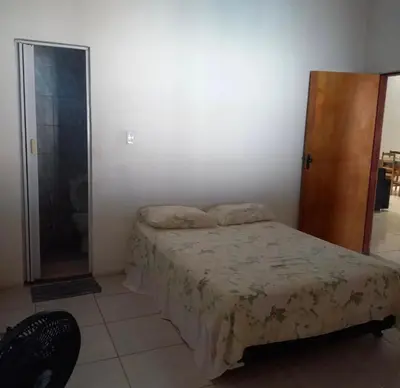 Uma cama ou camas num quarto em JW casa de praia