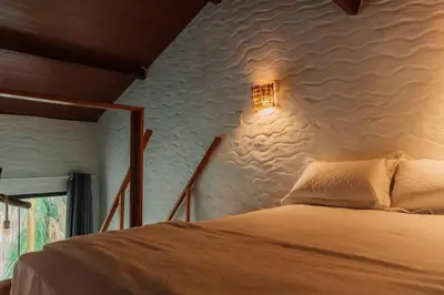 Uma cama ou camas num quarto em Chalé Aruanã , Banho sob as Estrelas a 100m do Mar