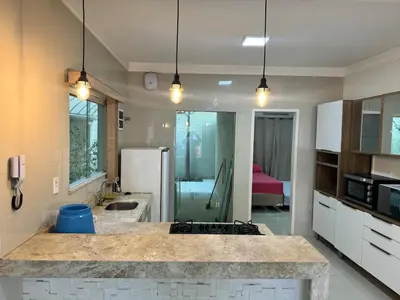 Uma casa de banho em Casa completa com 3 quartos,ar e garagem