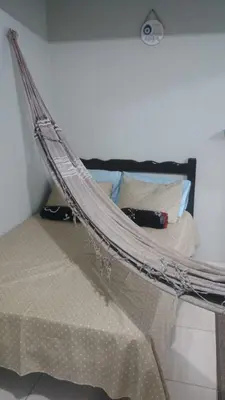 Uma cama ou camas num quarto em Ap do Jhone