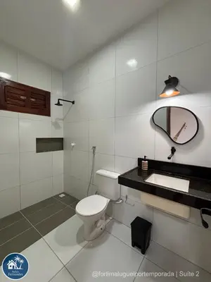 Uma casa de banho em Suites Fernandes Fortim