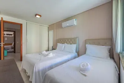 Uma cama ou camas num quarto em Scopa Beach #C5-200 - Pé na areia by Carpediem