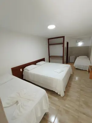 Uma cama ou camas num quarto em Hotel Fazenda Portal das Montanhas