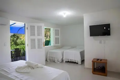 Uma cama ou camas num quarto em Hotel Fazenda Portal das Montanhas
