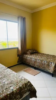 Uma cama ou camas num quarto em Apartamento Completo com Piscina e vista do mar a 5m do Beach Park