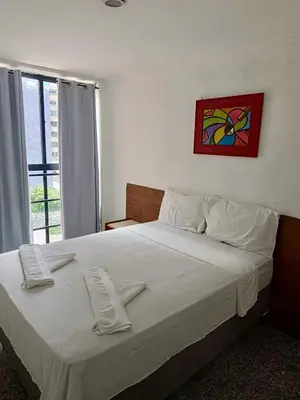 Uma cama ou camas num quarto em Flat atlantico 301