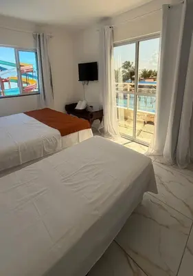 Uma cama ou camas num quarto em Cumbuco Acqua Beach Pousada