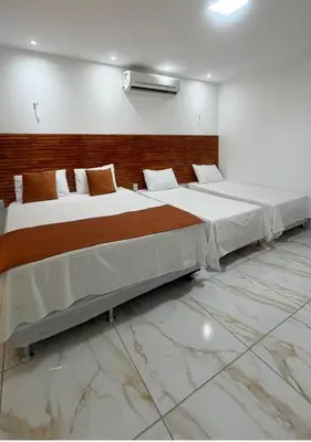 Uma cama ou camas num quarto em Cumbuco Acqua Beach Pousada