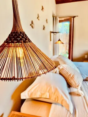 Uma cama ou camas num quarto em Chalé Caju Knots