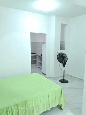 Uma cama ou camas num quarto em kit net Baturité 2