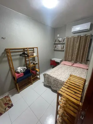 Uma cama ou camas num quarto em Apartamento Império das Marés