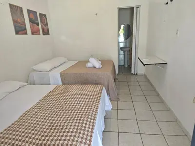 Uma cama ou camas num quarto em Casa Jambo Canoa Quebrada
